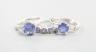 Two modern 18k white metal, tanzanite and diamond set dress rings, size J, gross 8.3 grams and a modern 9ct white gold and gem set ring, gross 2 grams.                                                                     