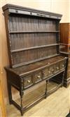 A 17th century style oak dresser W.153cm                                                                                               