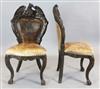 A pair of 19th century German carved walnut salon chairs, H.3ft 7in.                                                                   