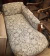 A Victorian oak upholstered chaise longue                                                                                              