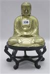 A Chinese brass figure of a seated Buddha, early 20th century,                                                                         