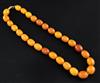 A single strand amber bead necklace, gross 53 grams, 46cm.                                                                             