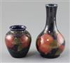 Two Moorcroft 'pomegranate' vases, c.1918-26, H.9cm and 15.3cm, bottle vase broken and restuck at neck                                 