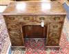 An early 20th century Queen Anne style walnut kneehole desk W.88cm                                                                     