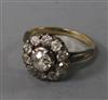 An early 20th century 18ct gold and diamond cluster ring, size K.                                                                      