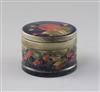 A Moorcroft 'pomegranate' pattern drum shaped box and cover, c.1918-26, diameter 8.8cm                                                 