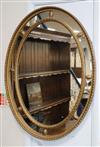 A gilt frame oval mirror H.82cm                                                                                                        