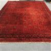 An Afghan red ground carpet 395cm x 300cm                                                                                              