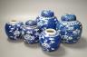 A pair of Chinese blue and white vases and eleven jars, six with covers., Vase and matching cover 28 cms high.                                                                                                              