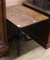 A Regency mahogany tripod table, the rectangular tilting top on a baluster-turned shaft and tripartite base W.59cm                     