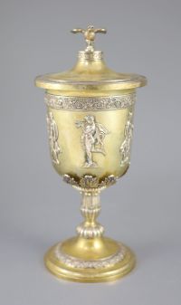 A late 19th/early 20th century German parcel gilt 800 standard presentation pedestal cup and cover, by Wollenweber,                    