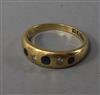 A late Victorian 18ct white gold, sapphire and diamond gypsy set ring, size M.                                                         