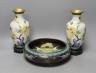A pair of Chinese cloisonné enamel vases, 25cm tall including stands, together with a Chinese cloisonné enamel dragon bowl (3)                                                                                              