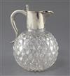 A late Victorian silver mounted cut glass claret jug by John Newton Mappin, 18cm.                                                      