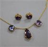 A 9ct gold and gem set necklace and pair of earrings.                                                                                  