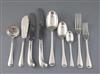 A late Victorian canteen of silver Hanovarian rat tail pattern flatware by Goldsmiths & Silversmiths Co, with velvet pouches.          