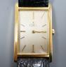 A gentleman's 750 yellow metal Ebel rectangular dial manual wind wrist watch, on associated leather strap, case diameter 22mm, gross weight 24.3 grams.                                                                     