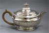 A George III silver demi fluted teapot, London, 1805, gross 23 oz.                                                                     