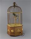 An early 20th century Swiss gilt metal mounted mahogany singing bird in a cage automaton, H.21in.                                      