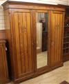 A large late Victorian pitched pine three door compactum wardrobe W.188cm                                                              