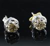 A pair of fancy yellow diamond and 18ct white gold ear studs, (the brilliant-cut diamonds approximately 1.0ct each).                   