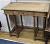 An oak desk in the manner of Philip Webb W.96cm                                                                                        