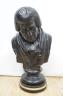 A black painted plaster bust of a judge, inscribed 1826, 49cms high.                                                                                                                                                        