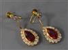 A pair of 18ct gold, synthetic ruby and diamond pear shaped drop earrings, 32mm.                                                       