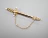 An Edwardian yellow metal and graduated seed pearl set dagger bar brooch, 60mm, gross weight 5 grams.                                                                                                                       