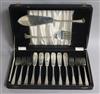 A cased set of six pairs of silver fish eaters and pair of matching servers, Elkington & Co, Birmingham, 1946/50, 29.5 oz.             