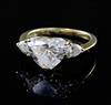 A 1980's Kutchinsky 18ct gold heart shaped diamond set dress ring with pear cut diamond set shoulders, size J.                         