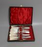 A cased set of six pairs of Edwardian mother of pearl handled silver dessert eaters, Sheffield, 1902.                                                                                                                       