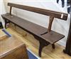 A late Victorian / Edwardian pitch pine railway bench with adjustable back W.273cm                                                     