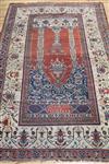 A Persian ivory and red ground prayer rug 210cm. x 130cm.                                                                              