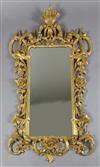 A late 19th century Chippendale style giltwood and gesso rococo carved wood wall mirror, 4ft 3in.                                      