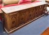 A late Victorian carved oak bookcase base section W.248cm                                                                              