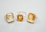 Three yellow metal and citrine set dress rings, one stamped 9ct, gross weight 11.9 grams.                                                                                                                                   