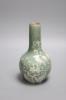 A Chinese celadon bottle vase with white slip decoration, 19th/20th century, height 20cm                                                                                                                                    