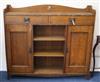 An Arts & Crafts oak bookcase W.137cm                                                                                                  