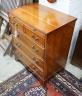 A small reproduction yew bachelor's chest of two short and three long drawers below brush slide, width 60cm, depth 40cm, height 74cm                                                                                        