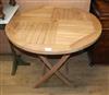 A circular teak folding garden table Diam.90cm                                                                                         