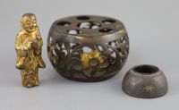 A Chinese bronze drum-shaped stand, a gilt bronze figure of a monk, 17th/18th century and a silver and gold inlaid iron waterpot, Qing,