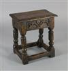 An oak joined stool, W.1ft 8in. D.1ft H.1ft 10in.                                                                                      