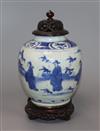 A Chinese Ming blue and white jar, Wanli period, hare mark, with hardwood stand and cover height excl. stand and cover 17cm            