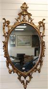 A pair of carved gilt-framed oval wall mirrors W.67cm                                                                                  