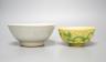 A Chinese Teksing cargo bowl c1820 and a yellow ground 'dragon' bowl. Largest 16cm diameter.                                                                                                                                