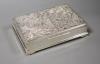 A Thai rectangular white metal cigarette box, 23.9cm,                                                                                                                                                                       