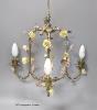 A floral encrusted brass three light ceiling fitting, width 40cm                                                                                                                                                            