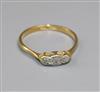 A small 18ct gold and three stone diamond ring, size O.                                                                                