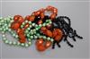 A jade necklace, carnelian necklace and black paste necklace.                                                                          